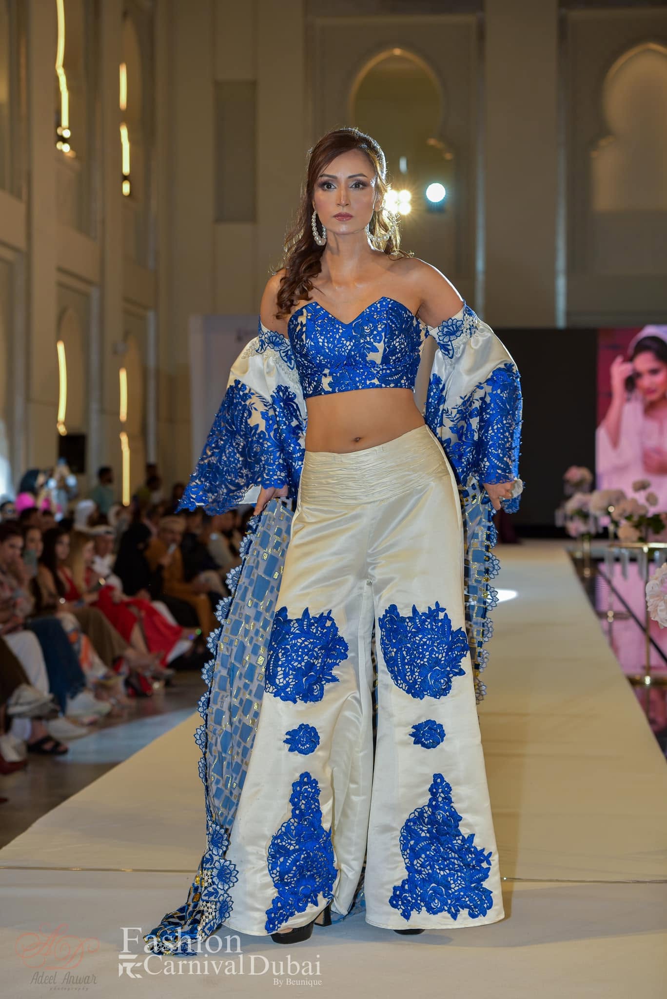 JDNEC’s blue and ivory ensemble on the Fashion Carnival Dubai runway